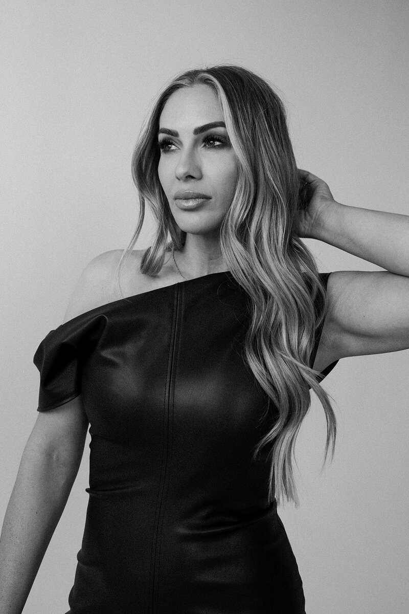 Savanna Frazier, co-founder of Frazier & Co Photography, an artist and visionary for luxury editorial wedding photography, captured in a contemplative portrait.