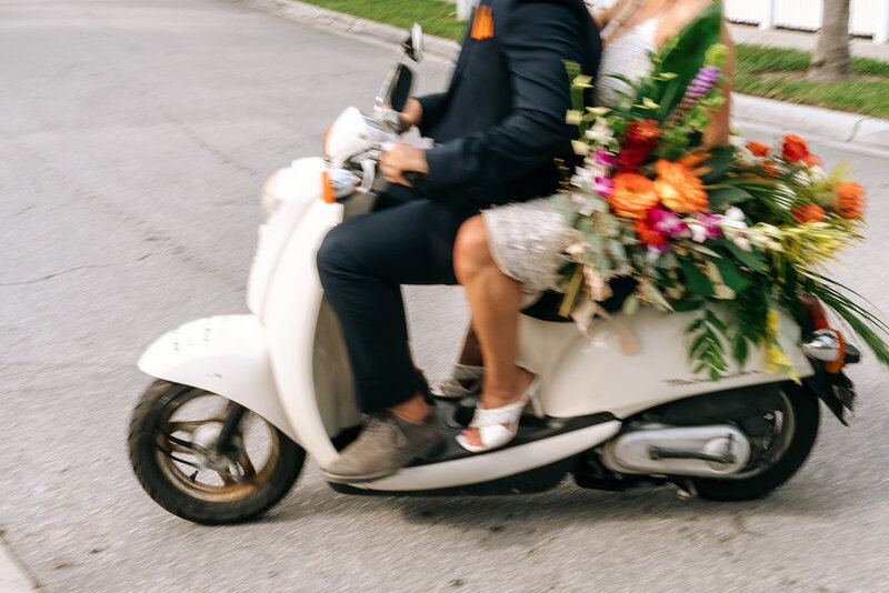 blurry moped with newlyweds