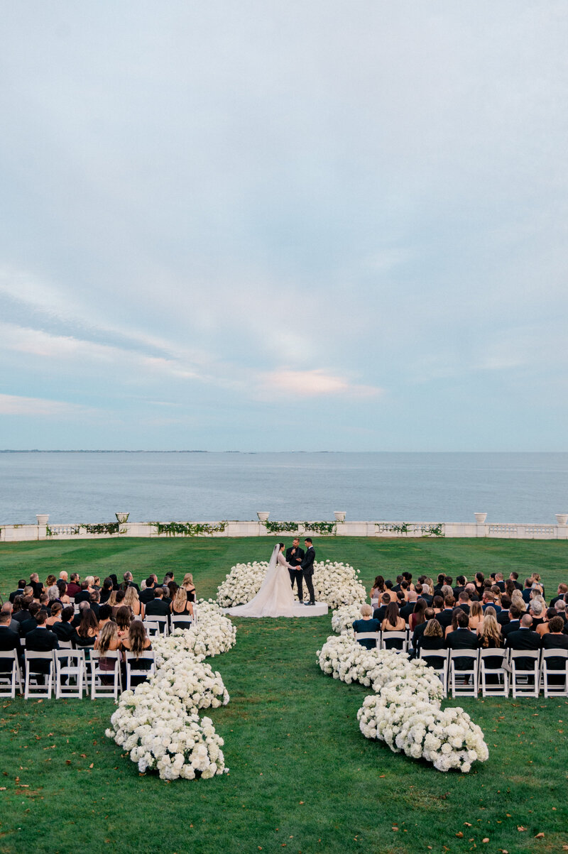 A wedding ceremony at the Rosecliff Mansion in Newport Rhode Island