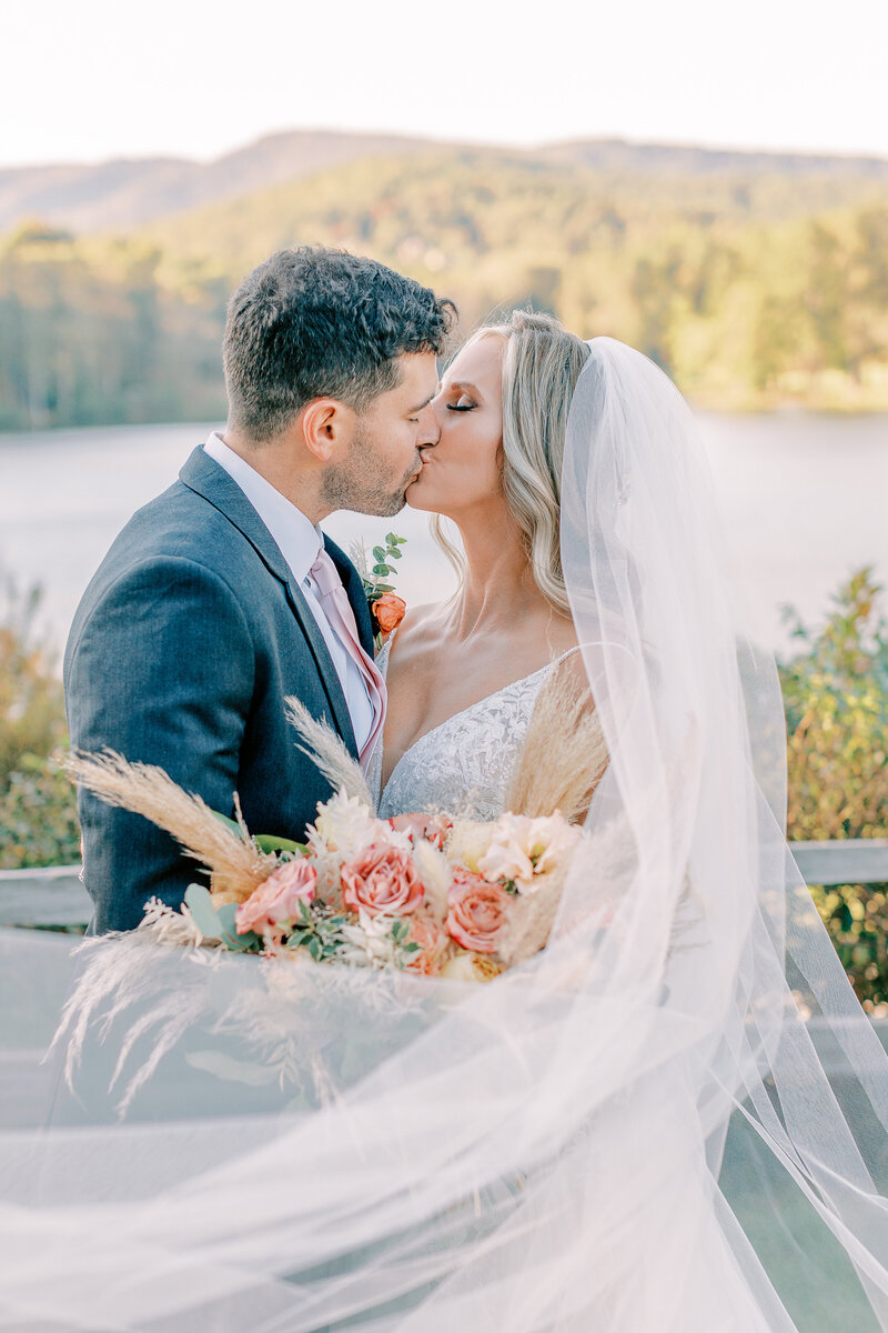 couple kiss at Atlanta mountain wedding
