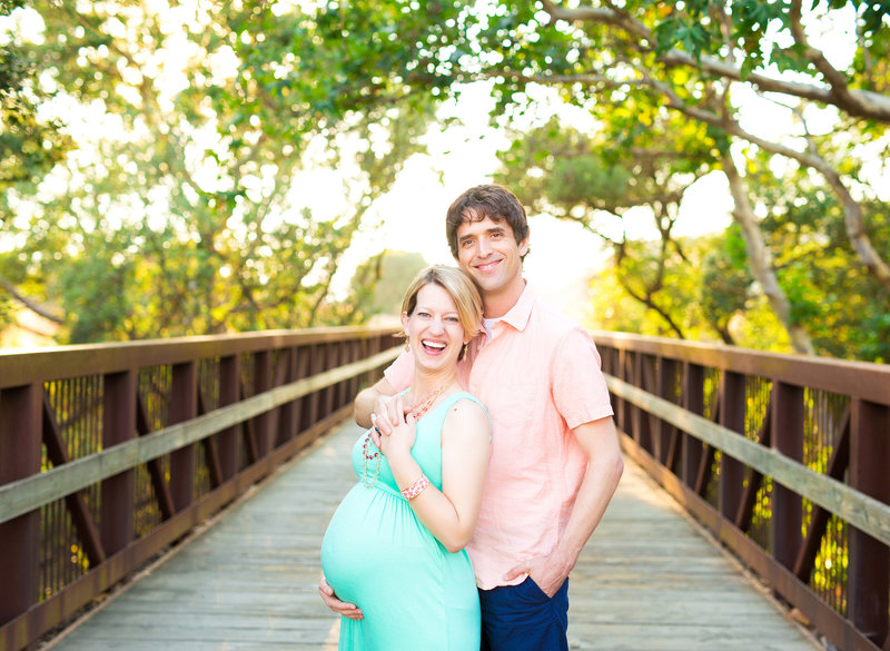 pregnant maternity couple bridge