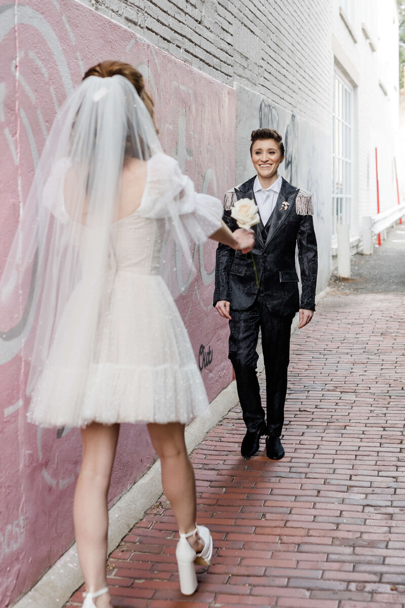 LGBTQ+ couple meeting in alley