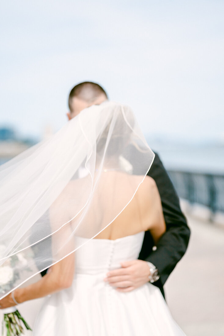 bride and groom embracing