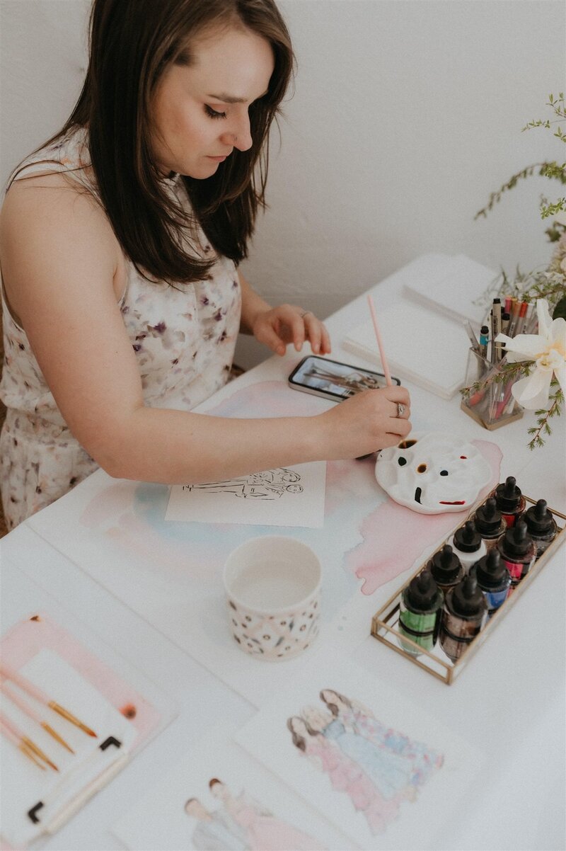 Stephanie Anne, Montreal watercolor artist, creating live wedding sketches with watercolor supplies and artistic tools