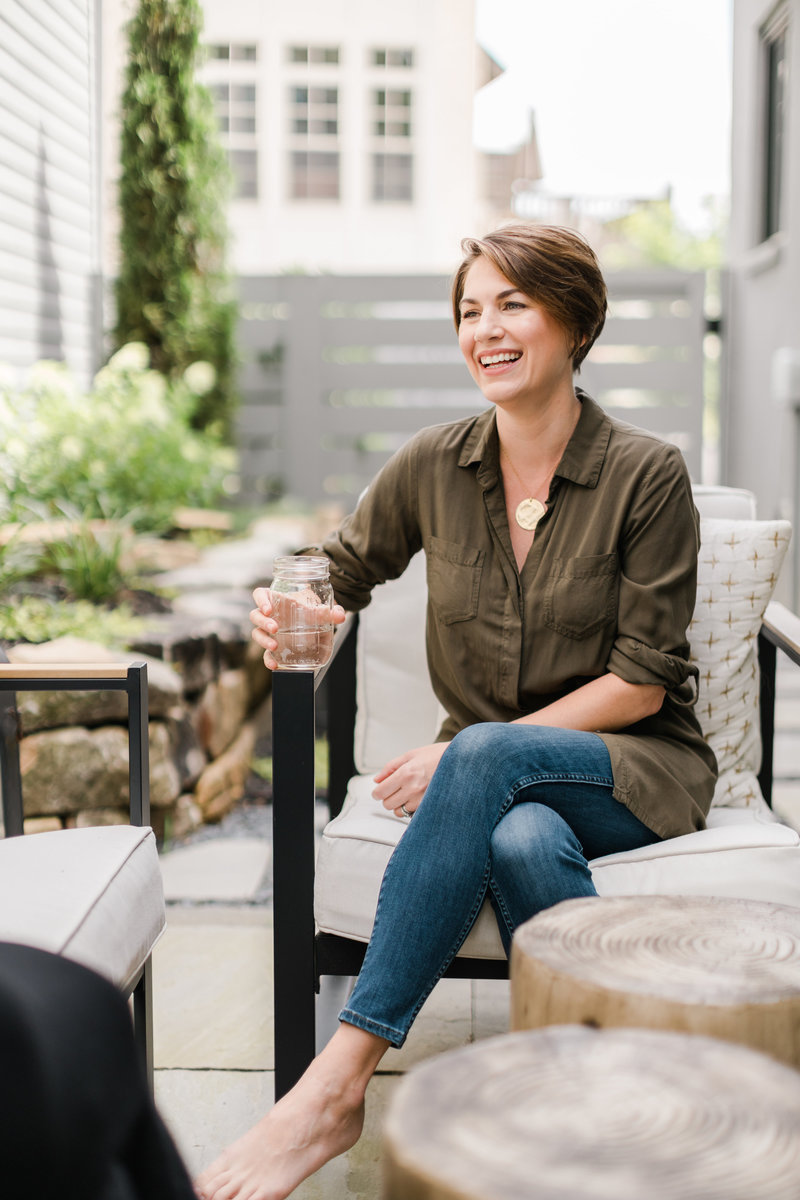 Career coach talks with client on a patio