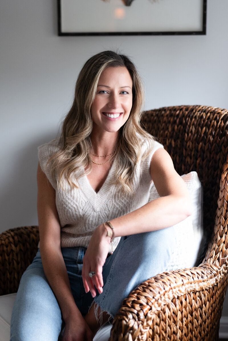Jen, an integrative health coach, standing in her home, showcasing her commitment to a balanced and active lifestyle.