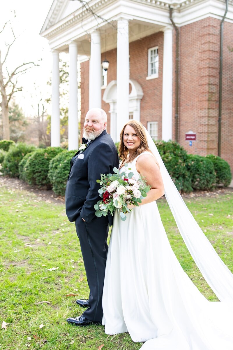 Bride and groom smiling at each other as they gaze into each others eyes