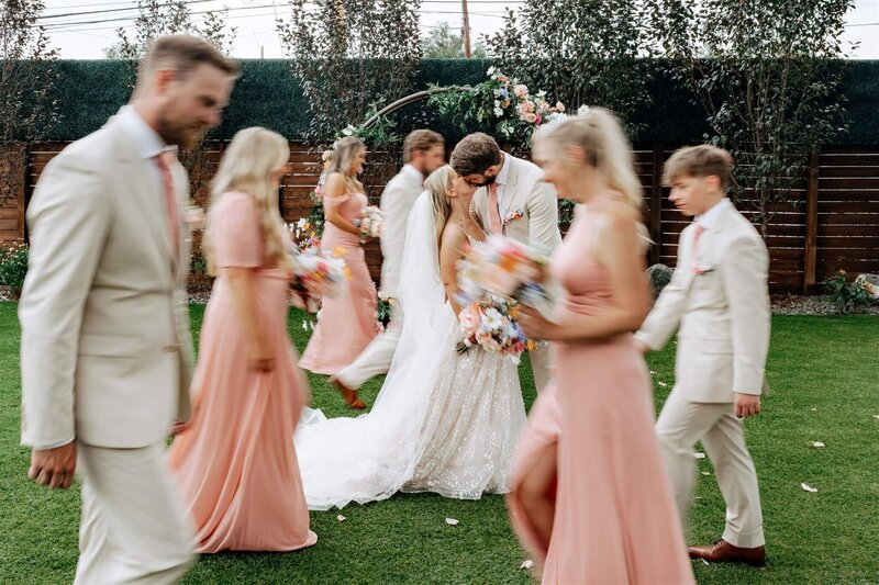 Bride and Groom Hugging on Marble Steps