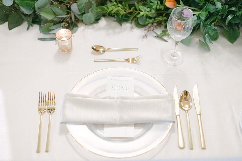 Elegant reception details captured inside Lupa Italian Restaurant in Banff, featuring beautifully arranged items that enhance the charm of this intimate venue.