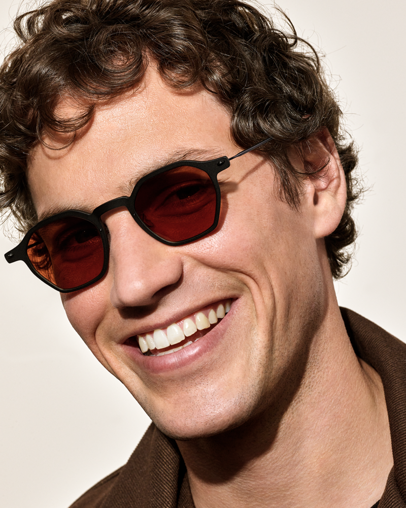 Close up shot of model wearing Lindberg sunglasses on a white backdrop
