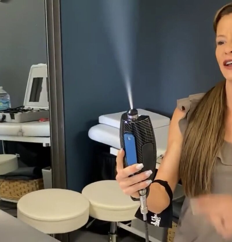 A close-up of an advanced cryotherapy machine used for treatments, showcasing the state-of-the-art equipment at 212 Salon, Spa, & Barbershop.