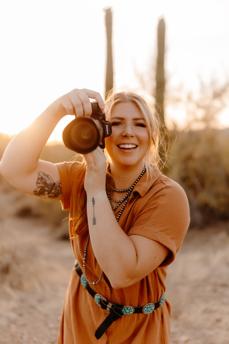 woman posing with camera