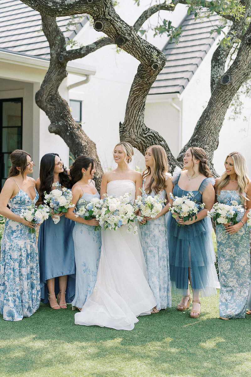 Bride and bridesmaids in blue dresses at The Arlo wedding planned by Bianca Nichole and Co