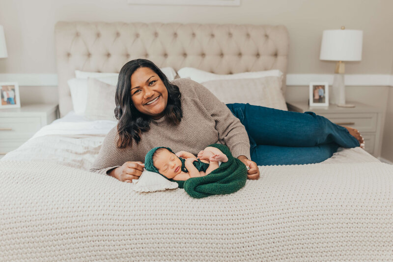 mom-laying-with-swaddled-newborn-sleeping-peacefully
