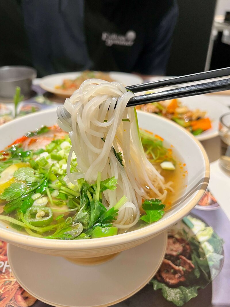 Bowl of pho with chopsticks — family travel memories and food culture reflections on the Leaving Main Street blog