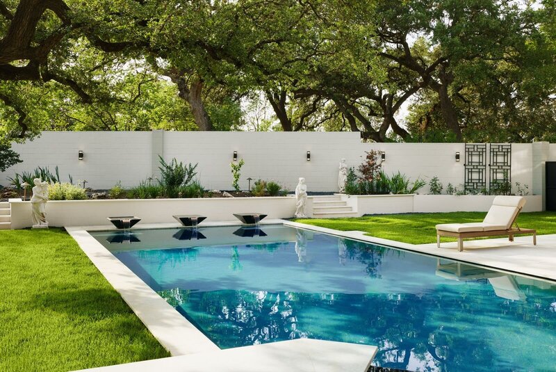 custom in-ground pool and luxury landscaping for modern family home in central texas.