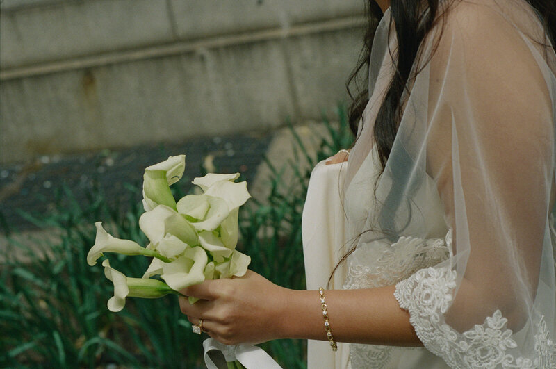 bride holding flowers after elopement ceremony shot by Elsie Goodman Photography | NYC Elopement Packages