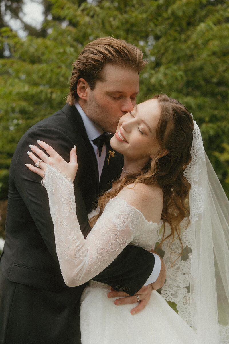 bride and groom kissing, candid in between moments