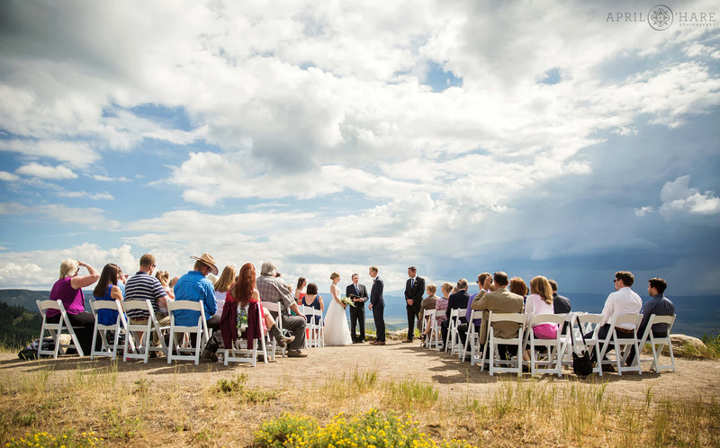 Wedding ceremony at the Vista Overlook as a storm rolls in at Steamboat Springs Resort in Colorado