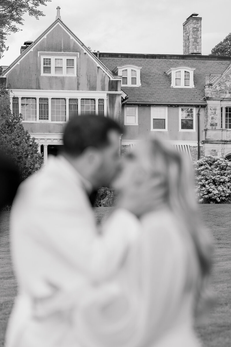 Wedding Photographer in Newport, RI, CT, and beyond | The Corteses | Back shot of bride and groom walking up the steps.