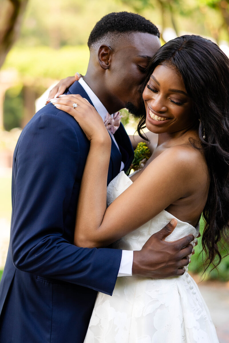 Discover the timeless elegance of this black and white wedding portrait, capturing a joyful embrace between a bride and groom. Perfect for wedding inspiration and photography enthusiasts seeking romantic and intimate moments.
