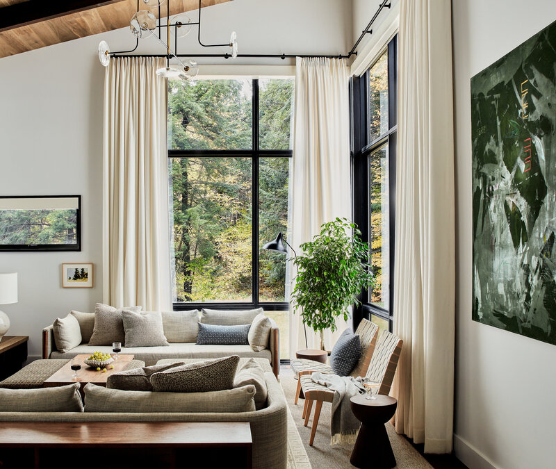 Interior design firms Boston created a modern Vermont mountain house blending natural materials, warm tones, and panoramic mountain views.