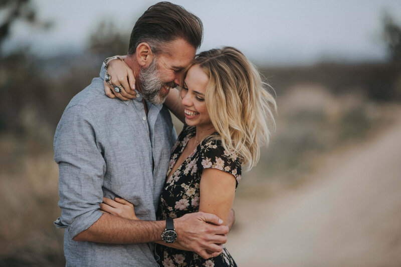 couple lovingly embraces in the desert
