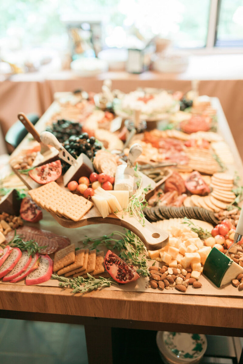 large charcuterie board with meats and cheeses