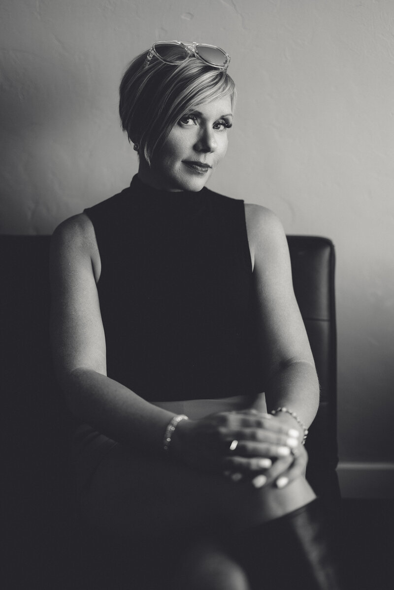 Natalie smiling with fireplace in the background