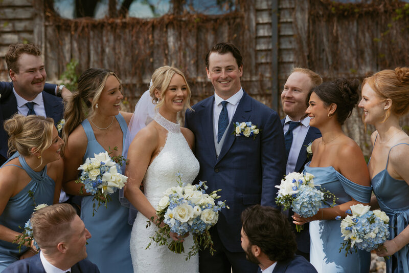 groom dipping bride for a kiss in their ceremony aisle