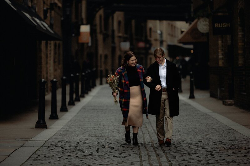 LGBTQ+ engagement photoshoot in London historical street of Shad Thames