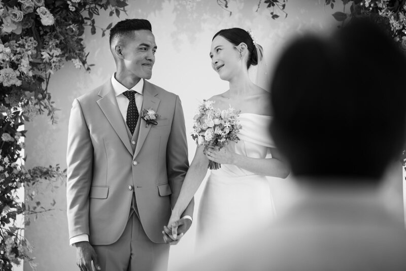 groom kisses bride on the head in the Secret Forest in Jeju Island