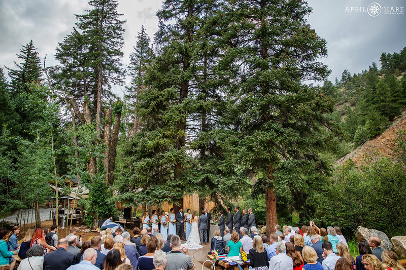 Ceremony under the trees at Blackstone Rivers Ranch in Colorado