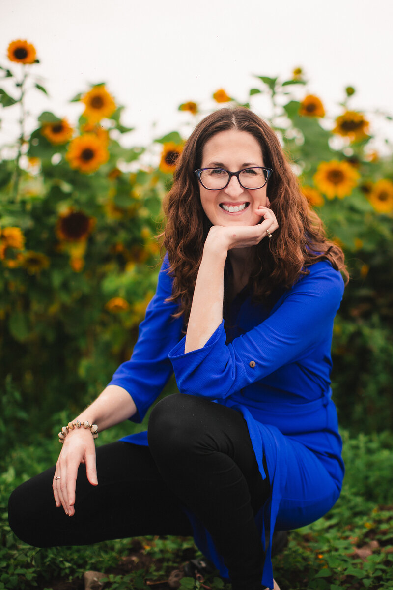 Jennifer in a blue and white shirt smiling