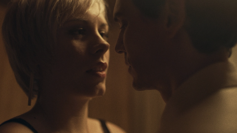 A wide frame of modern high-rises and gritty low-rise buildings in one visual composition.