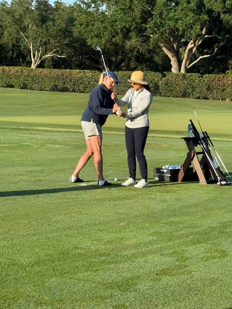 Renee O’Higgins, PGA and LPGA golf instructor giving a golf lesson at Quail West in Naples, Florida.