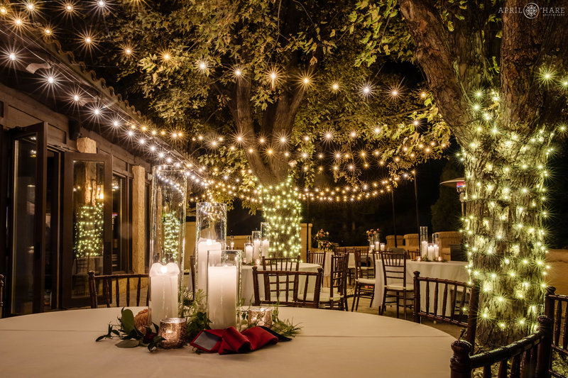 Outdoor terrace lit with string lights at Villa Parker at a Fall Wedding in Colorado