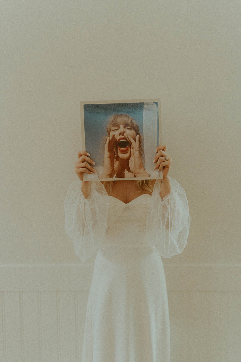 Creative bridal portrait by Pennsylvania wedding photographer with vinyl cover