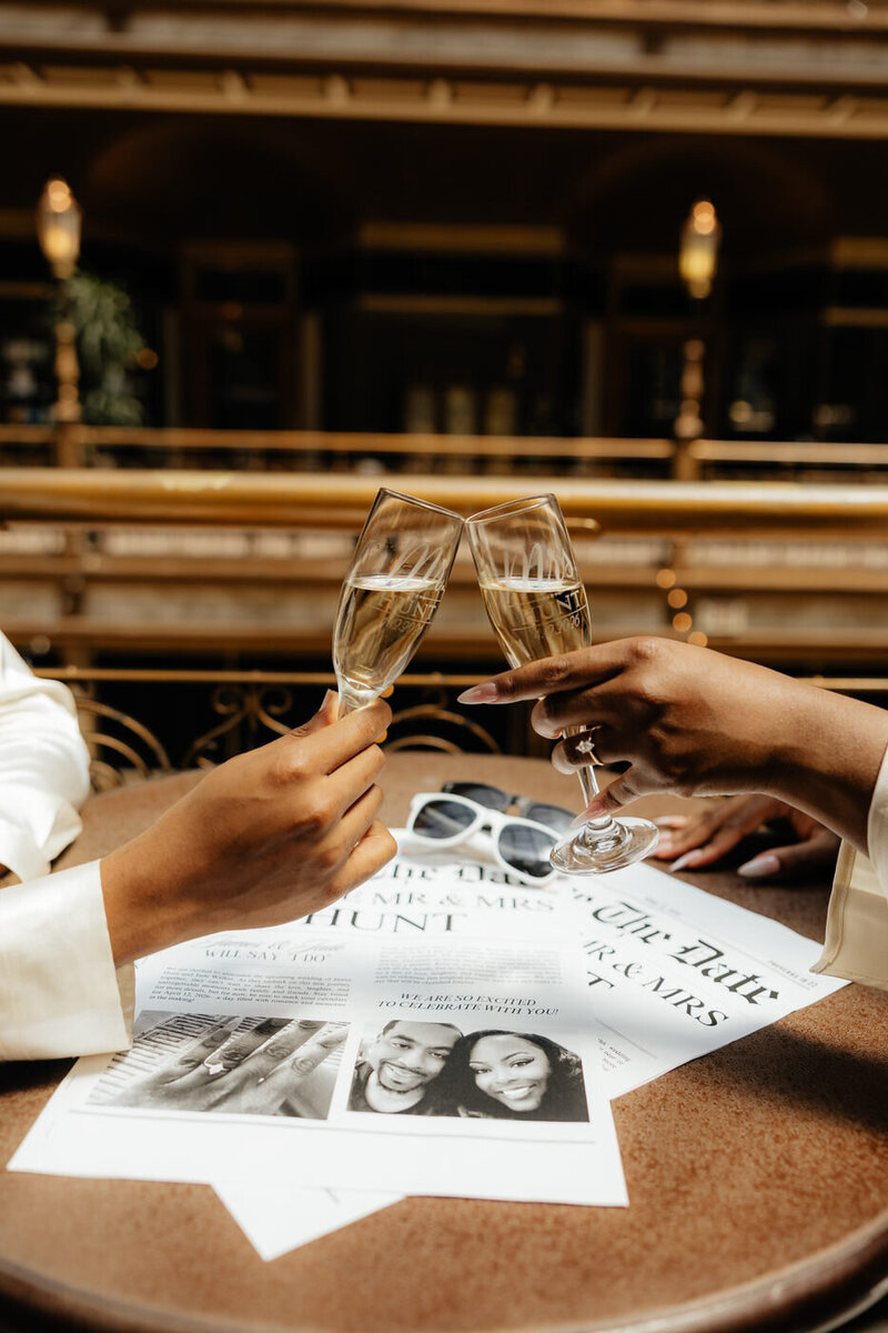 An engaged couple cheers each other at the Arcade.