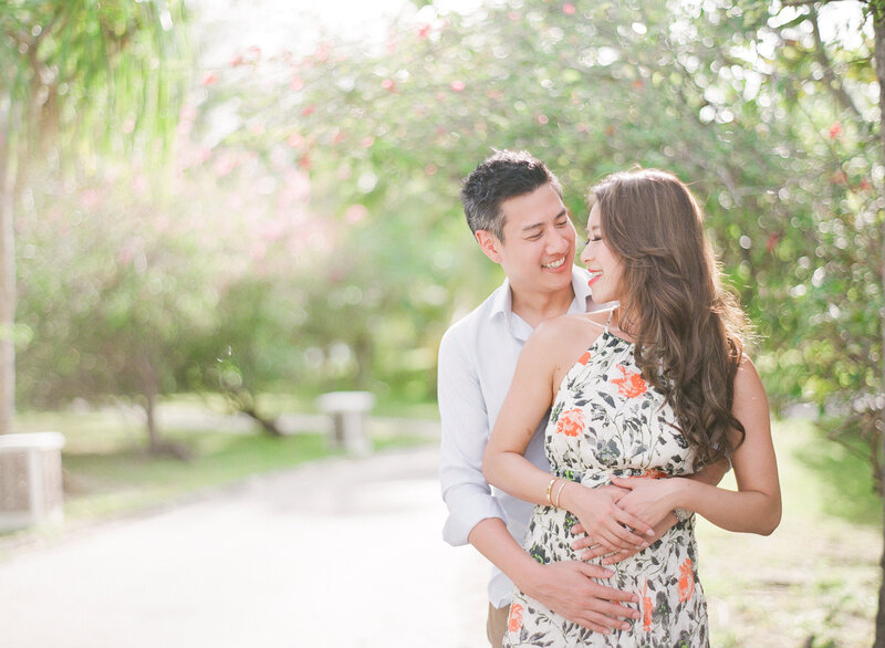Couple smiling elegant dress in the St Regis Bora Bora gardens
