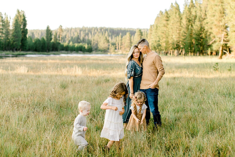Family in a field in YEllowstone National Park