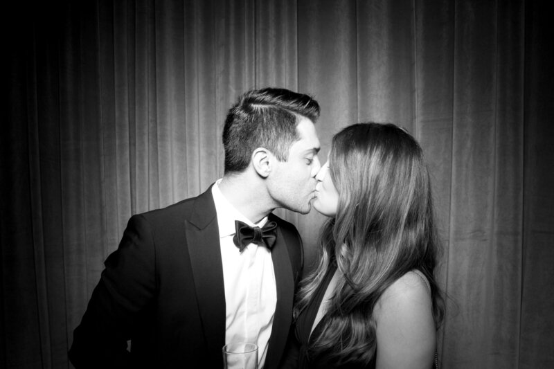 wedding guests kissing for vintage photo booth by Fotably