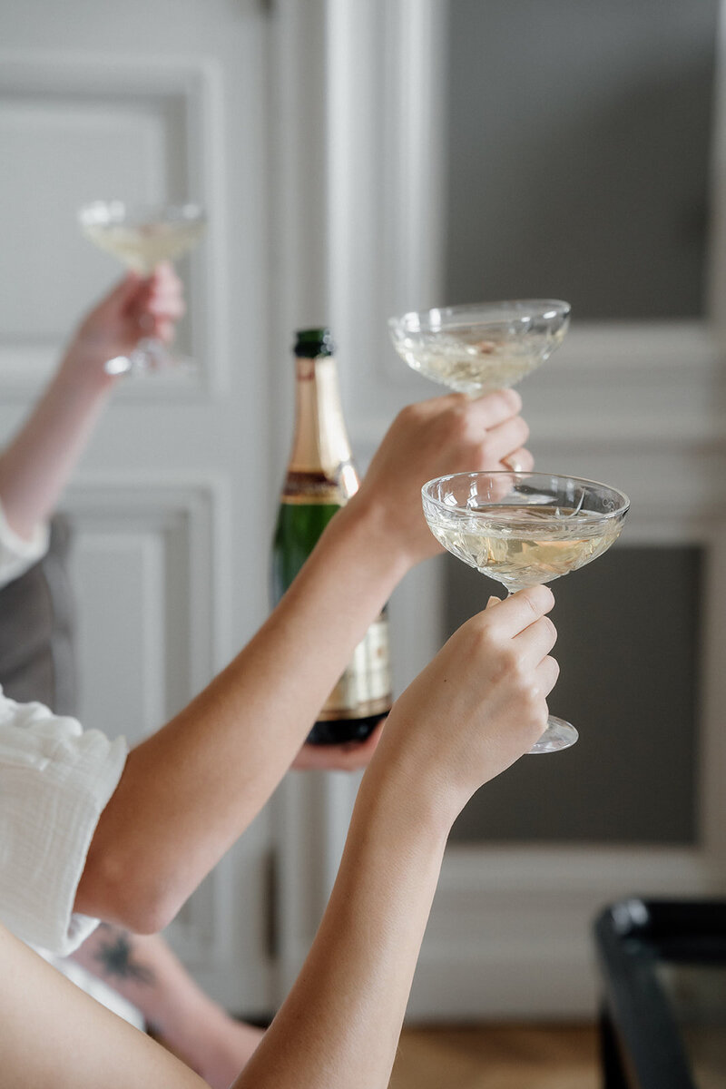 San Francisco Wedding Photographer, bridal party lifting up champagne flutes for a toast