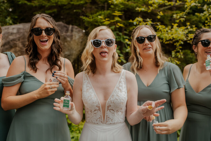 bride doing a shot with her wedding party