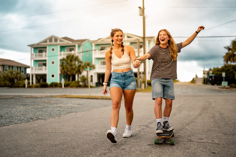 teens on a skateboard during senior photography session in north carolina
