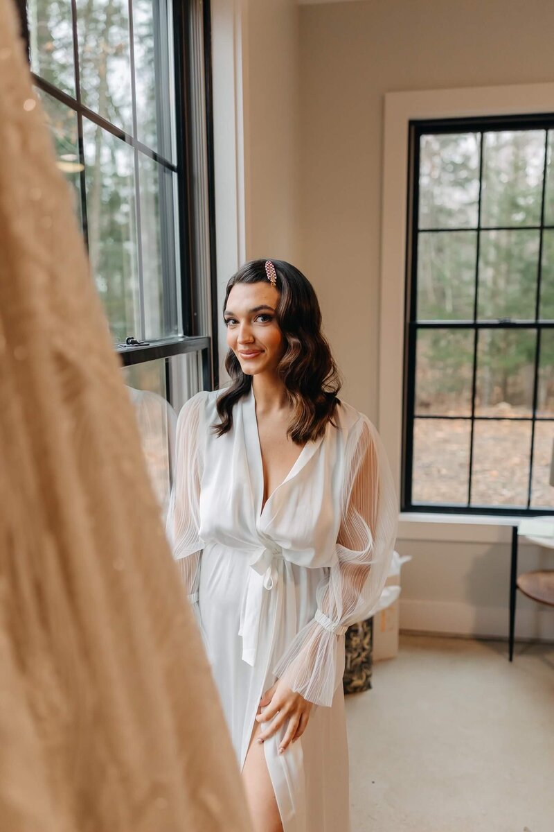 Bride in front of window