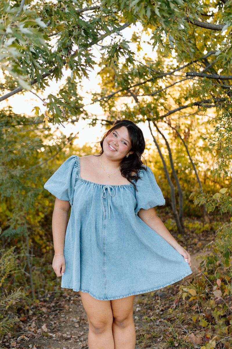 girl playfully poses in dress in kansas city missouri