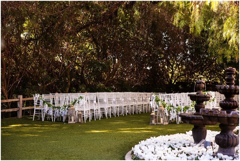 The Natural Forest ceremony site at Green Gables Wedding Estate in San Marcos, set up with chairs for a wedding ceremony.