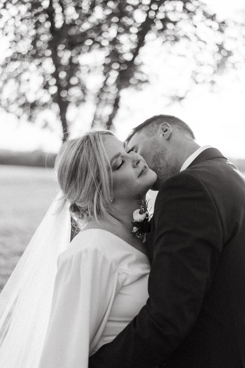 bride and groom kissing in topeka kansas