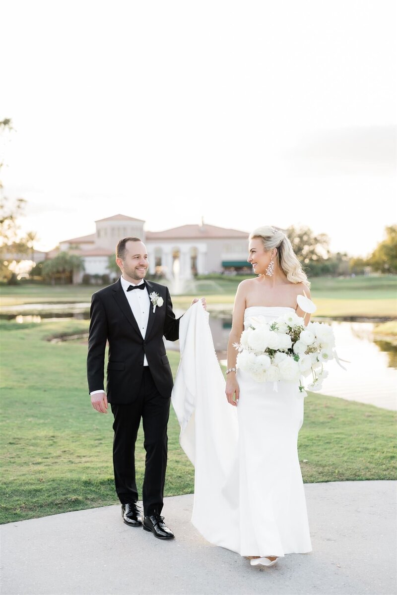 Bride and Groom Portrait on a golf course at the Country Club of Orlando by Orlando wedding photographer